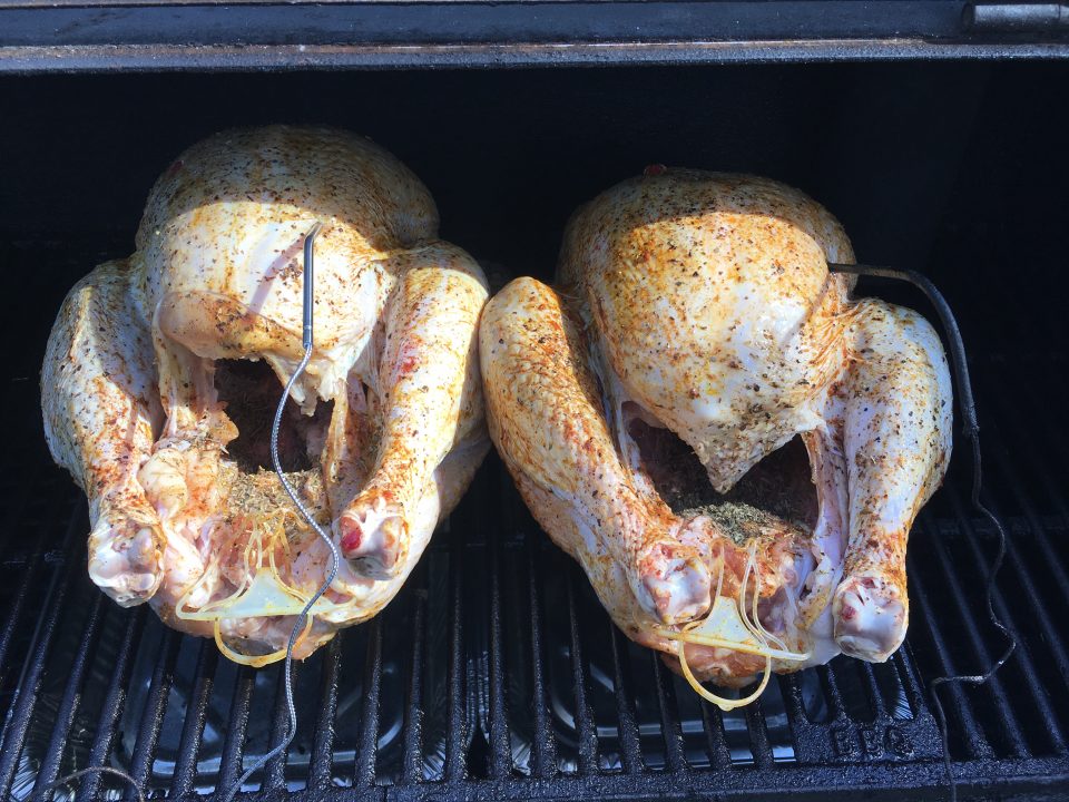Turkey on an offset smoker with thermometer probes and water pans